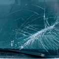 Are windshield cracks covered under new car warranty?